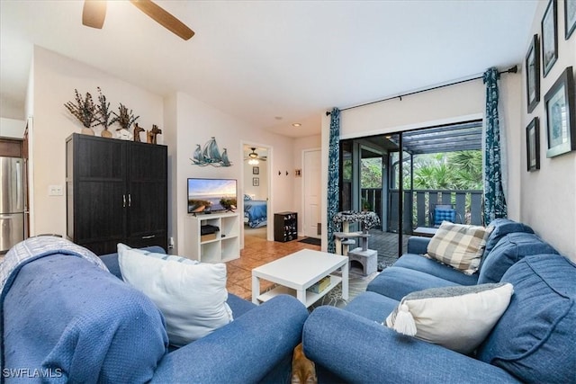 living room featuring ceiling fan and light tile patterned floors