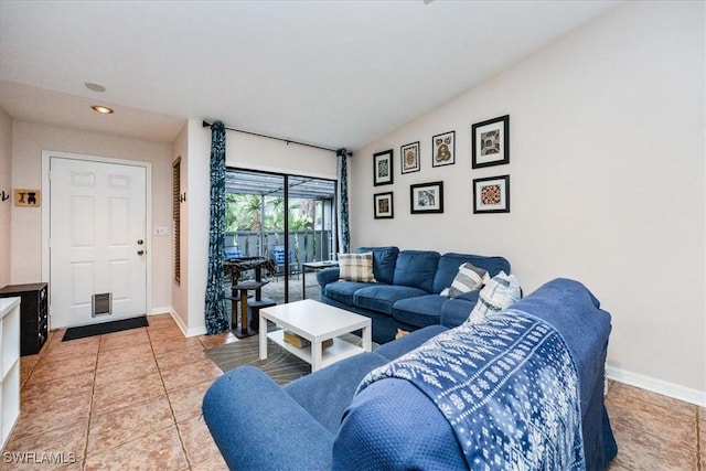 living room featuring recessed lighting, baseboards, vaulted ceiling, and tile patterned floors