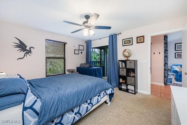 bedroom with light carpet, multiple windows, and ceiling fan