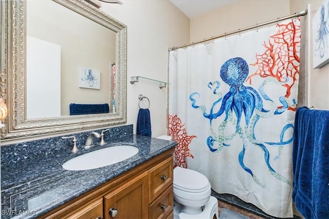 bathroom with toilet and vanity