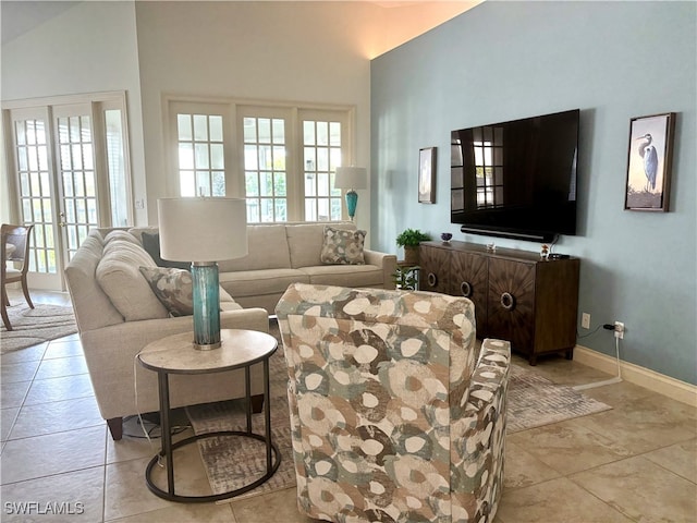 living room with light tile patterned floors and baseboards