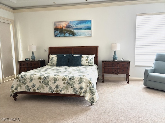 bedroom featuring ornamental molding, carpet flooring, and baseboards