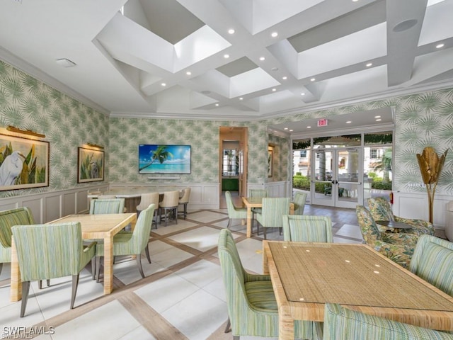 dining space featuring recessed lighting, wainscoting, and wallpapered walls