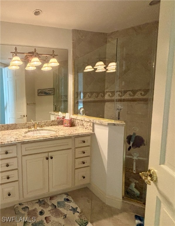 bathroom with vanity and a walk in shower