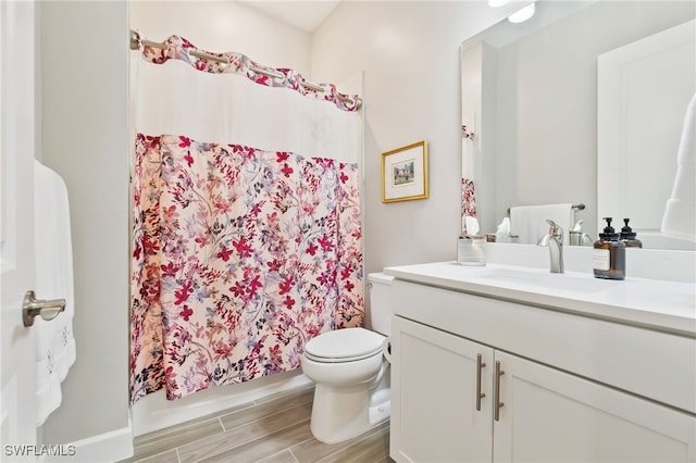 bathroom with toilet and vanity