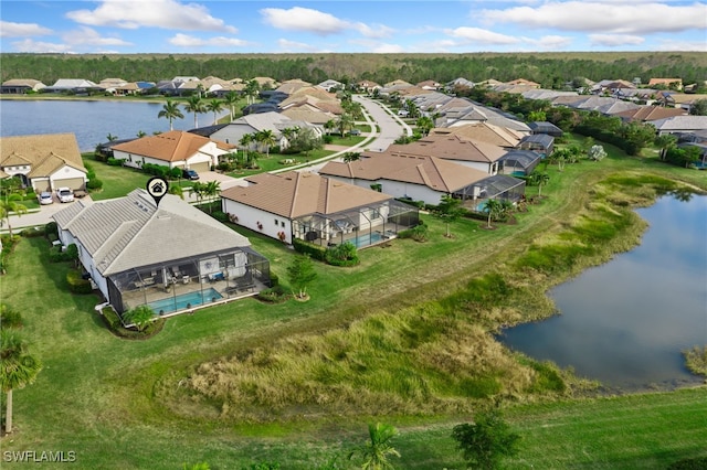 drone / aerial view with a water view