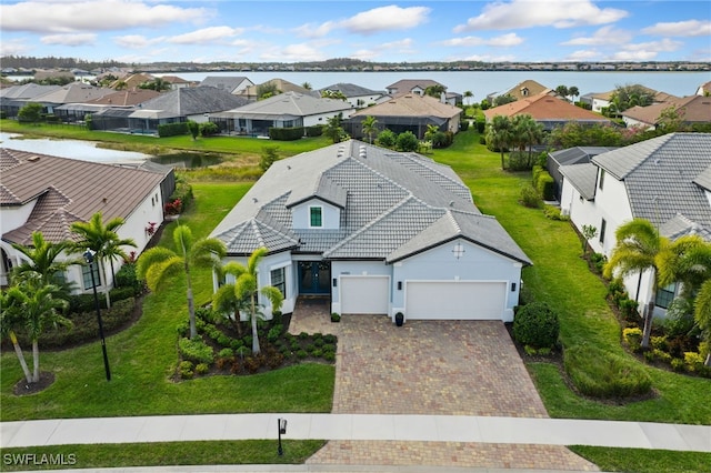 birds eye view of property with a water view