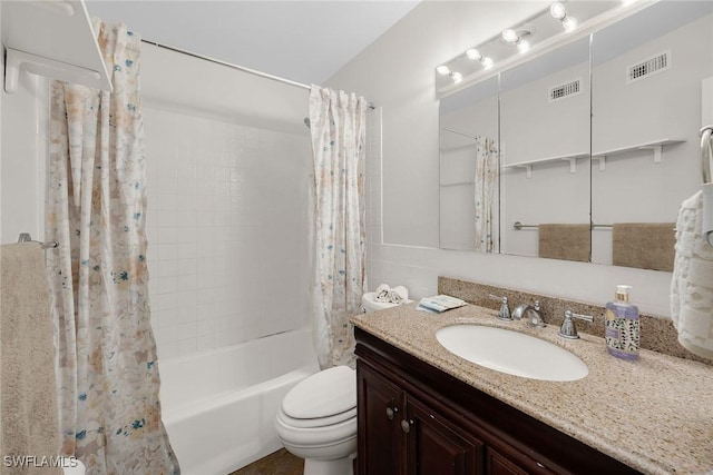 full bathroom featuring toilet, vanity, and shower / tub combo