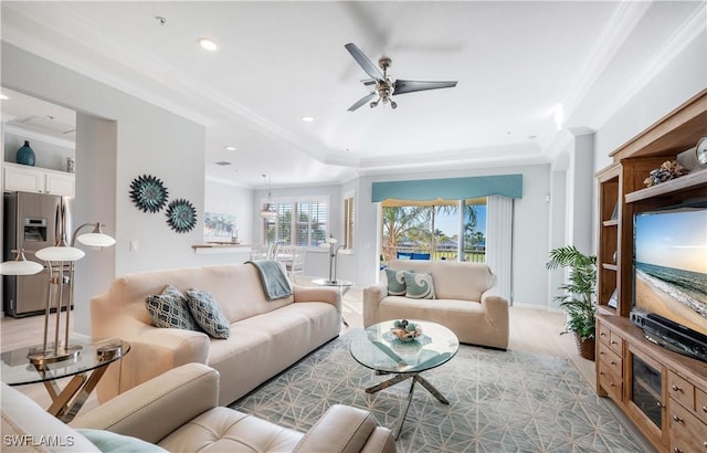 living room featuring crown molding and ceiling fan