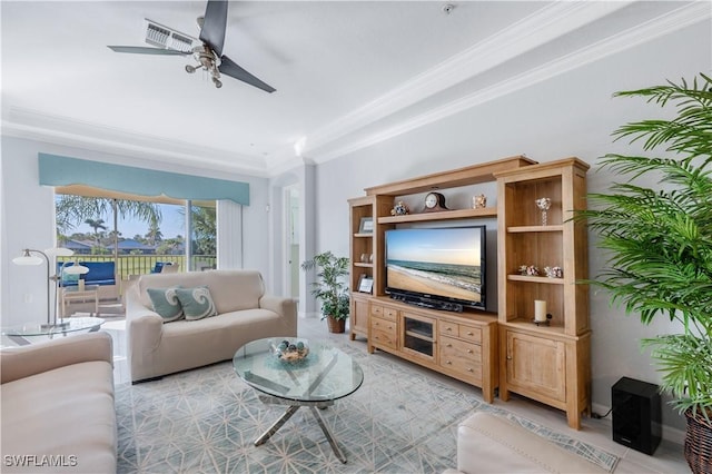 living room with ornamental molding and ceiling fan