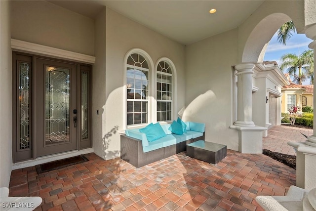 doorway to property featuring french doors and outdoor lounge area