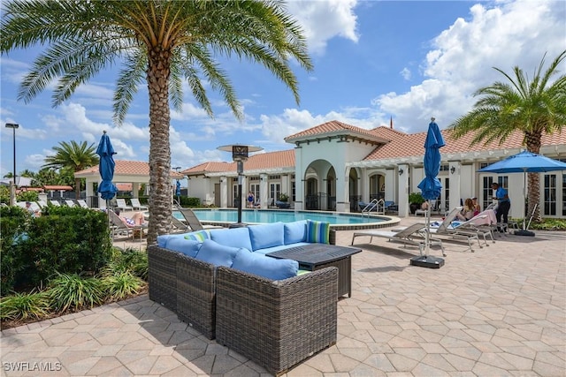 view of swimming pool with a patio