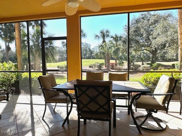 sunroom with ceiling fan