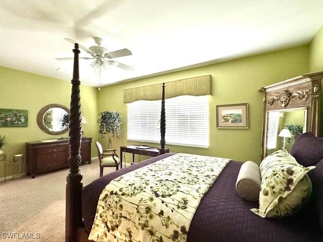 carpeted bedroom featuring ceiling fan