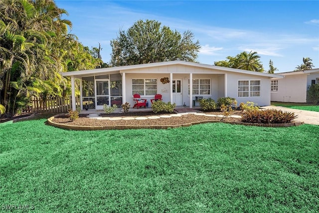 3760 12th St N, Naples, FL 34103 - single story home with a front lawn and a sunroom
