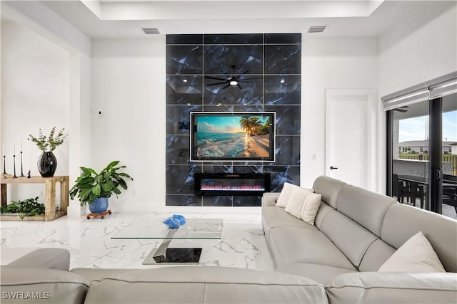 living room featuring a fireplace and visible vents