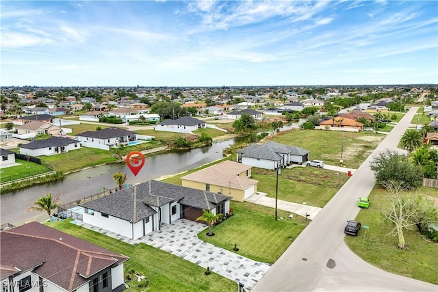 aerial view with a water view and a residential view