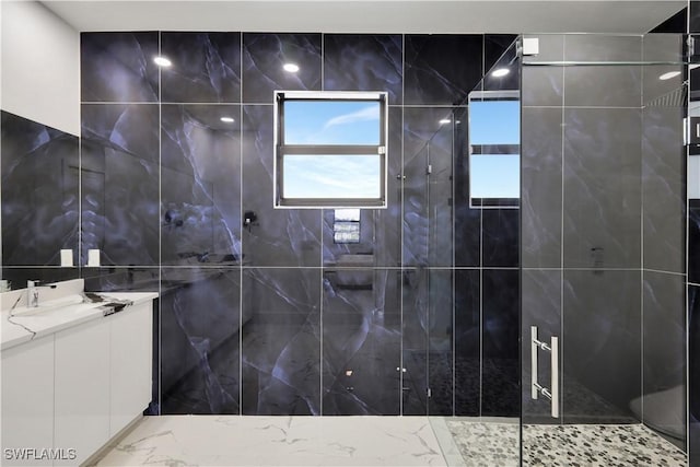 bathroom with an enclosed shower and vanity