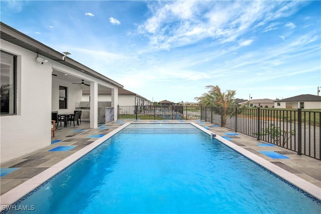 view of pool featuring a patio, fence, a ceiling fan, and a fenced in pool