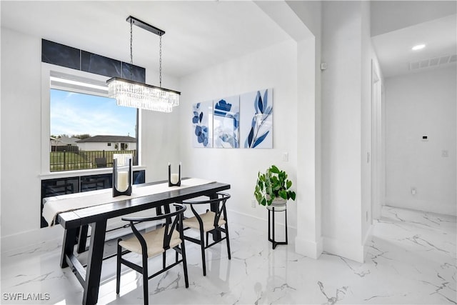 dining area featuring a chandelier