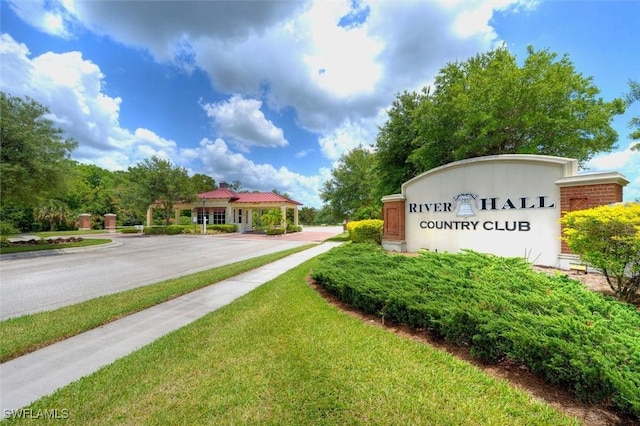 view of property's community with a lawn