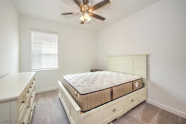 bedroom featuring ceiling fan and light colored carpet