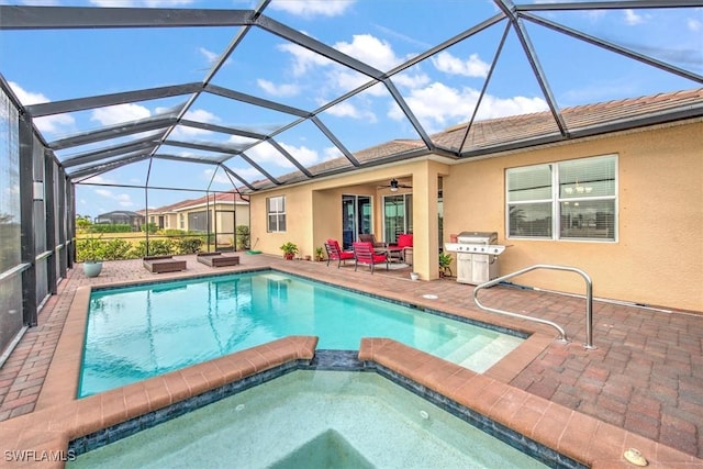 view of swimming pool featuring an in ground hot tub, area for grilling, glass enclosure, and a patio area