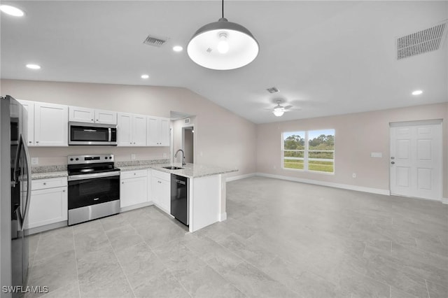 kitchen with appliances with stainless steel finishes, white cabinetry, sink, hanging light fixtures, and kitchen peninsula