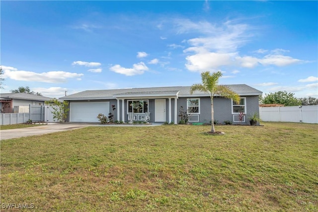 ranch-style house featuring a front yard and a garage