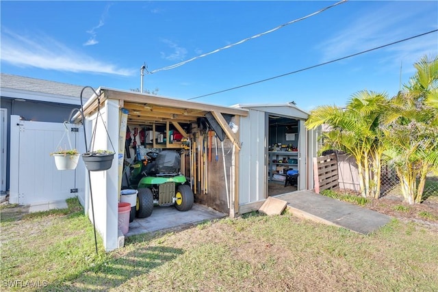 view of outbuilding featuring a lawn