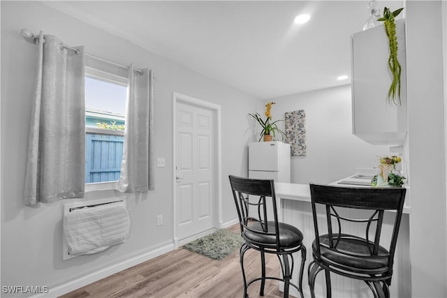 dining room featuring light hardwood / wood-style flooring