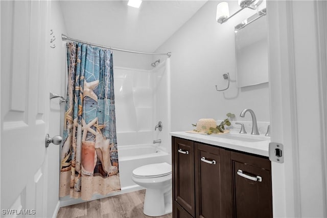 full bathroom with toilet, wood-type flooring, vanity, and shower / bath combo with shower curtain