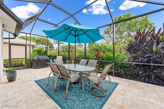 view of patio featuring a lanai and grilling area