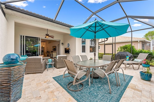 view of patio / terrace featuring ceiling fan, area for grilling, outdoor lounge area, and a lanai