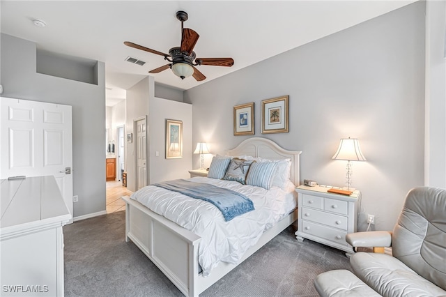 bedroom featuring ceiling fan and dark carpet