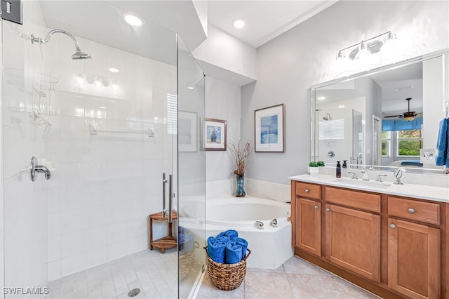 bathroom featuring ceiling fan, tile patterned floors, separate shower and tub, and vanity