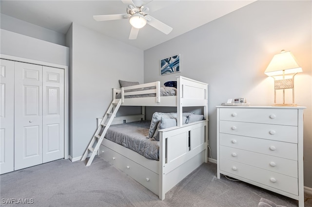 bedroom featuring ceiling fan, a closet, and carpet floors