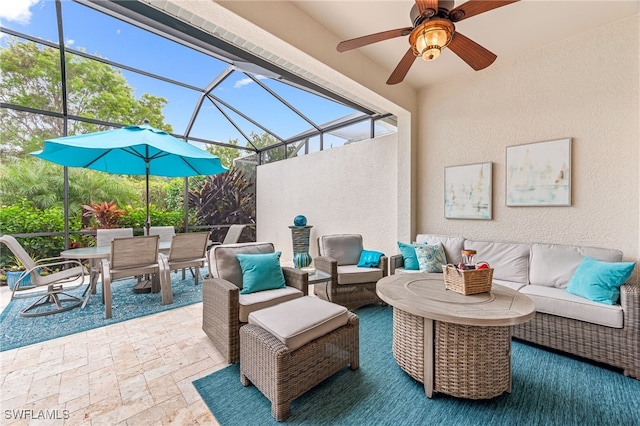 view of patio with glass enclosure, an outdoor living space, and ceiling fan