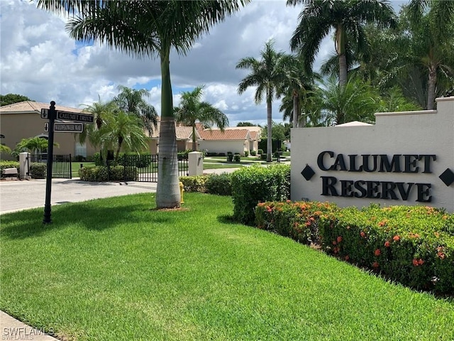 community / neighborhood sign with a lawn