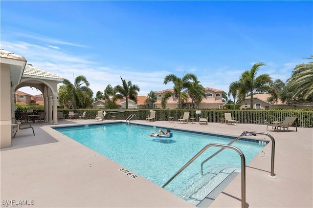 view of pool featuring a patio