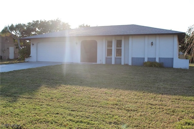 ranch-style home featuring a front yard and a garage