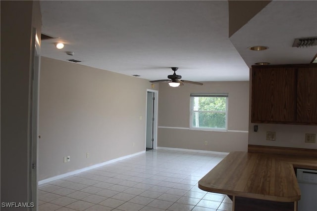 kitchen with ceiling fan, light tile patterned flooring, and dishwasher