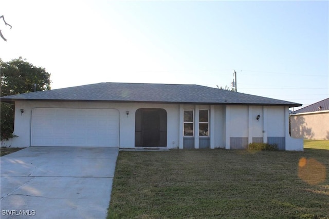 ranch-style house featuring a garage and a front yard