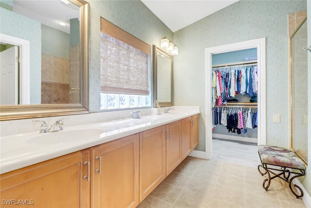 14113 Tivoli Ter, Bonita Springs, FL 34135 - full bathroom with double vanity, tile patterned floors, a spacious closet, and tiled shower