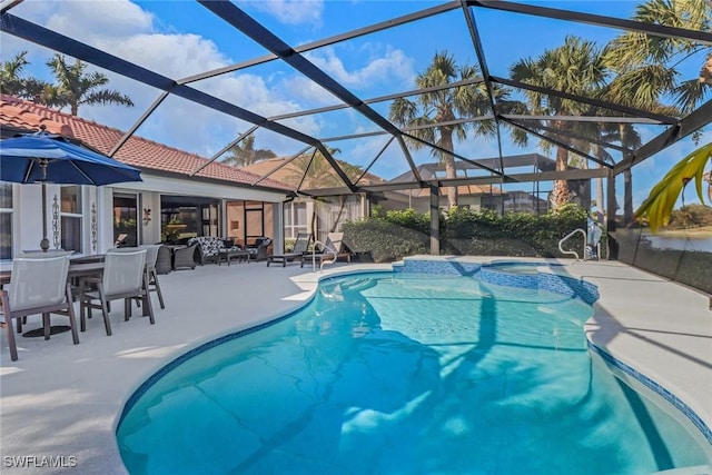 14113 Tivoli Ter, Bonita Springs, FL 34135 - outdoor pool featuring a patio, an in-ground hot tub, and glass enclosure