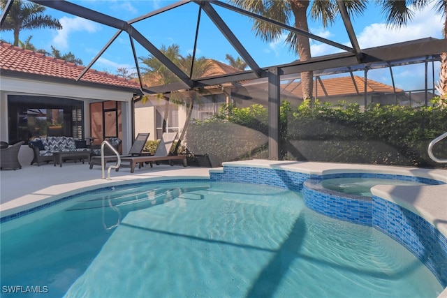 view of swimming pool with an in ground hot tub, glass enclosure, and a patio area