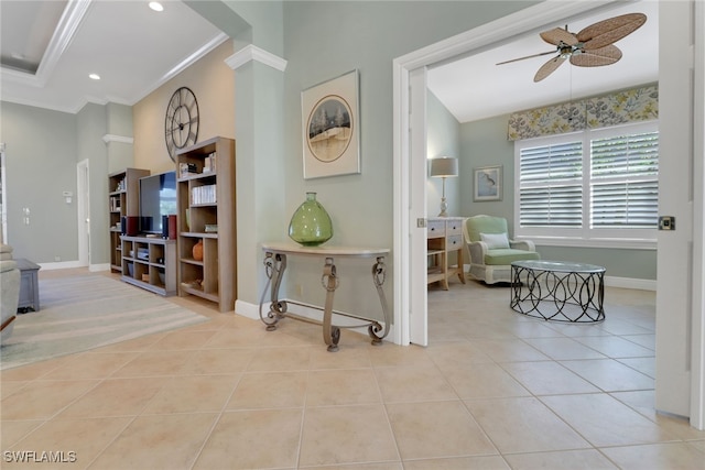 corridor with light tile patterned floors and crown molding