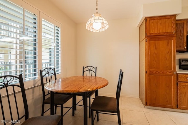 dining area featuring light tile patterned floors