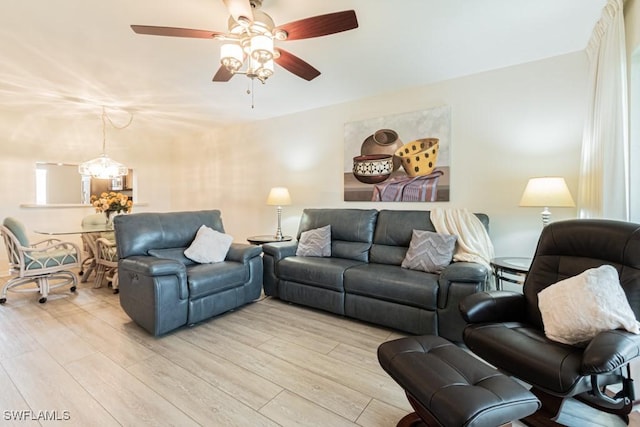 living room featuring light hardwood / wood-style floors and ceiling fan