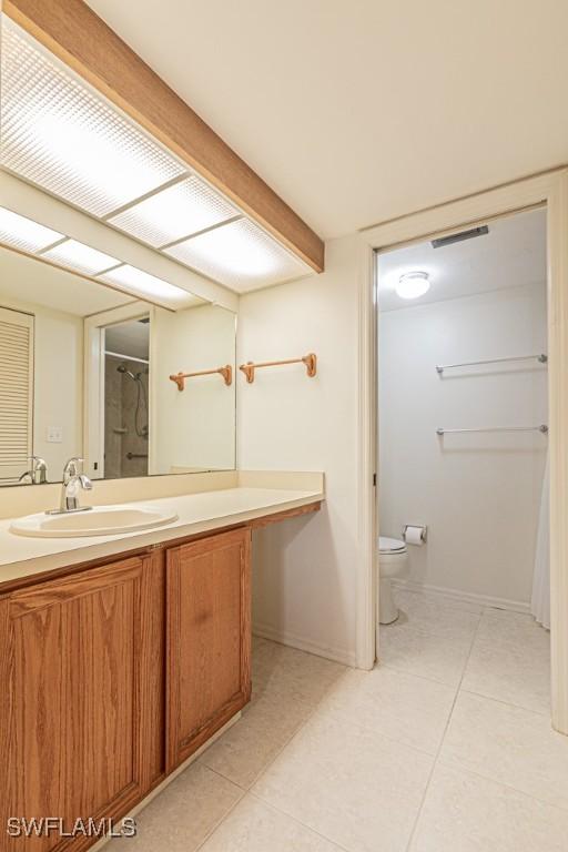 bathroom with toilet and vanity